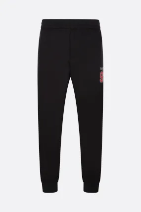  ALEXANDER McQUEEN pantalone jogging in rete jersey con intarsio logo McQueen 92 