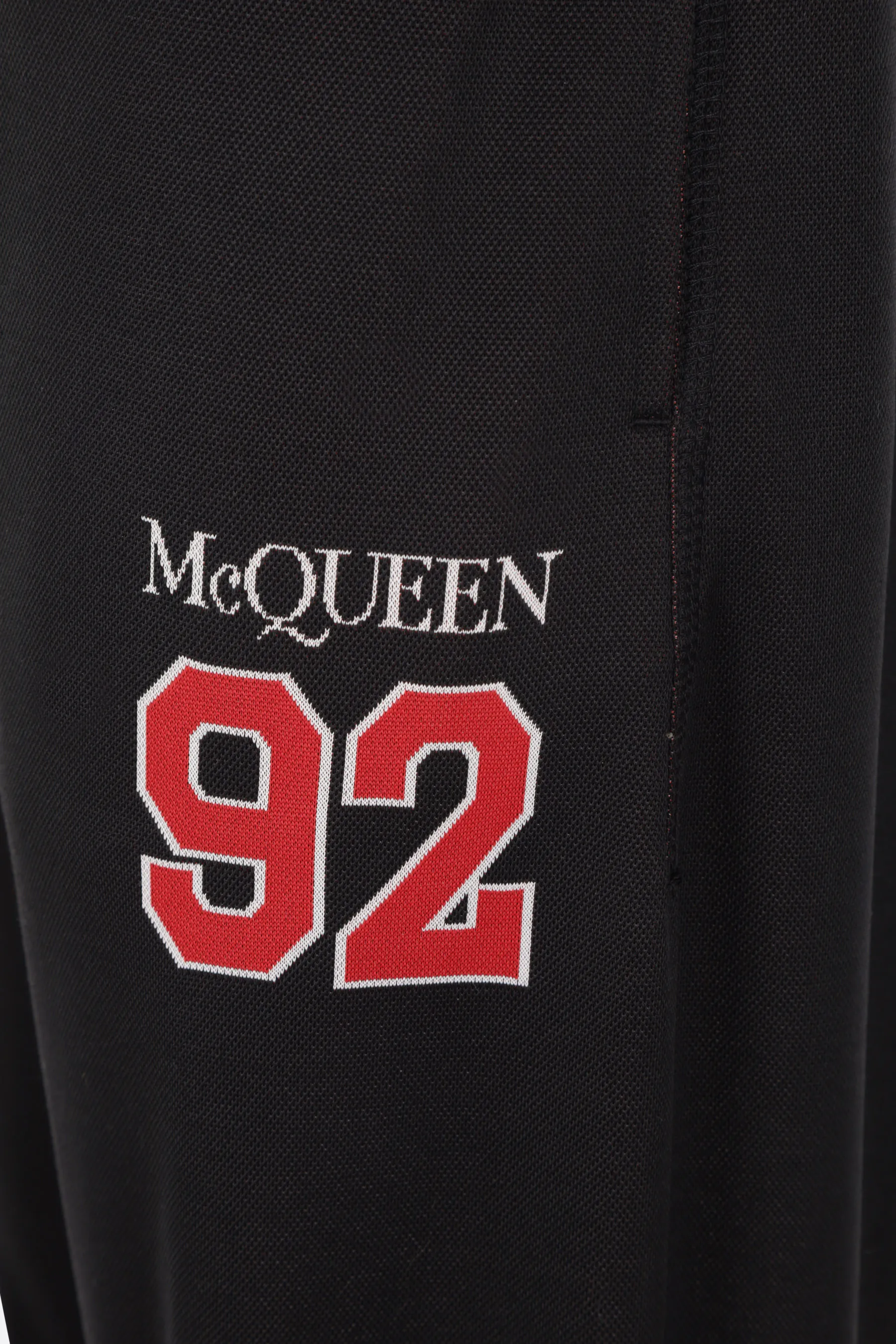  ALEXANDER McQUEEN pantalone jogging in rete jersey con intarsio logo McQueen 92 