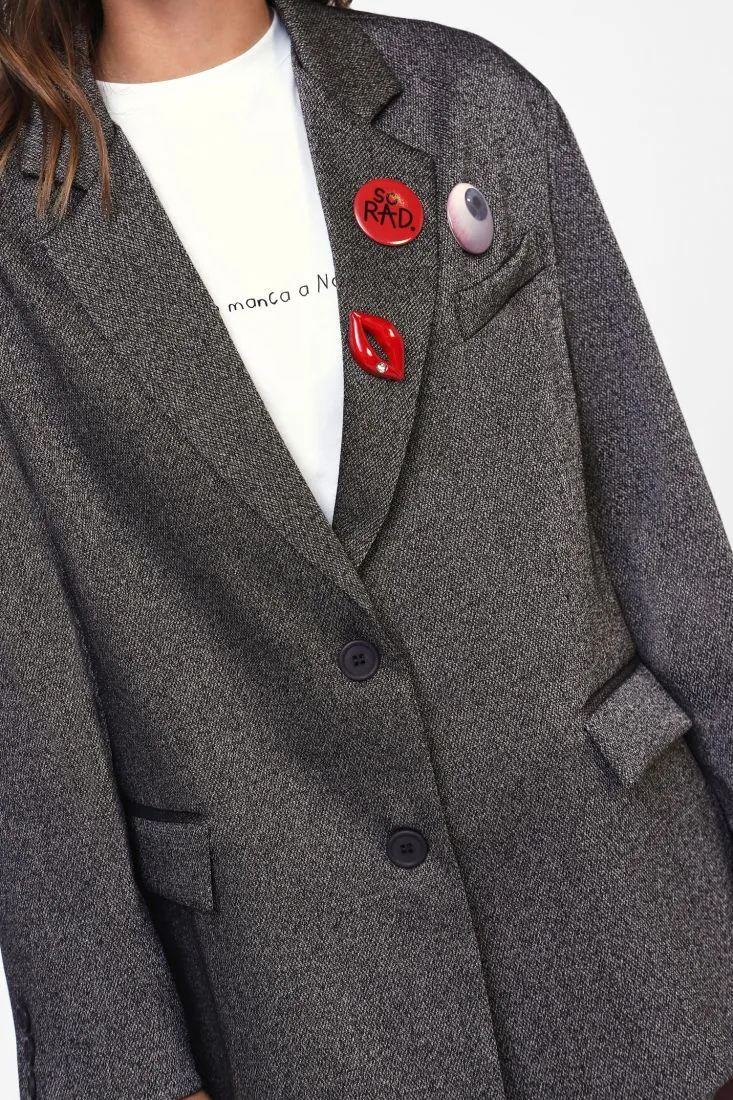  Oversized blazer with decorative brooches    